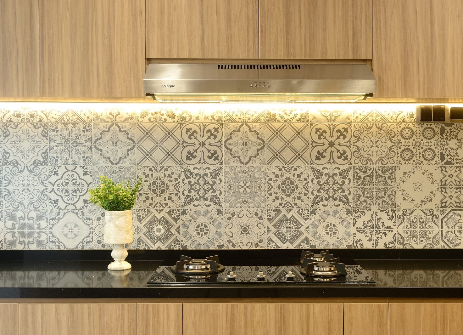 Encaustic splashback over black granite, earlier work by Aura Design & Co.